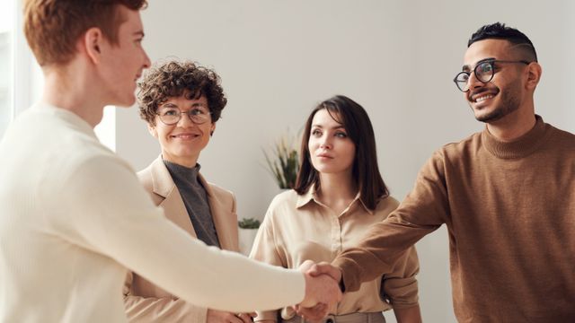 handshake demonstrating teamwork and cooperation
